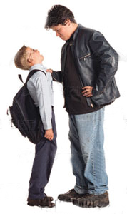 Bully in jacket picking on smaller boy with backpack